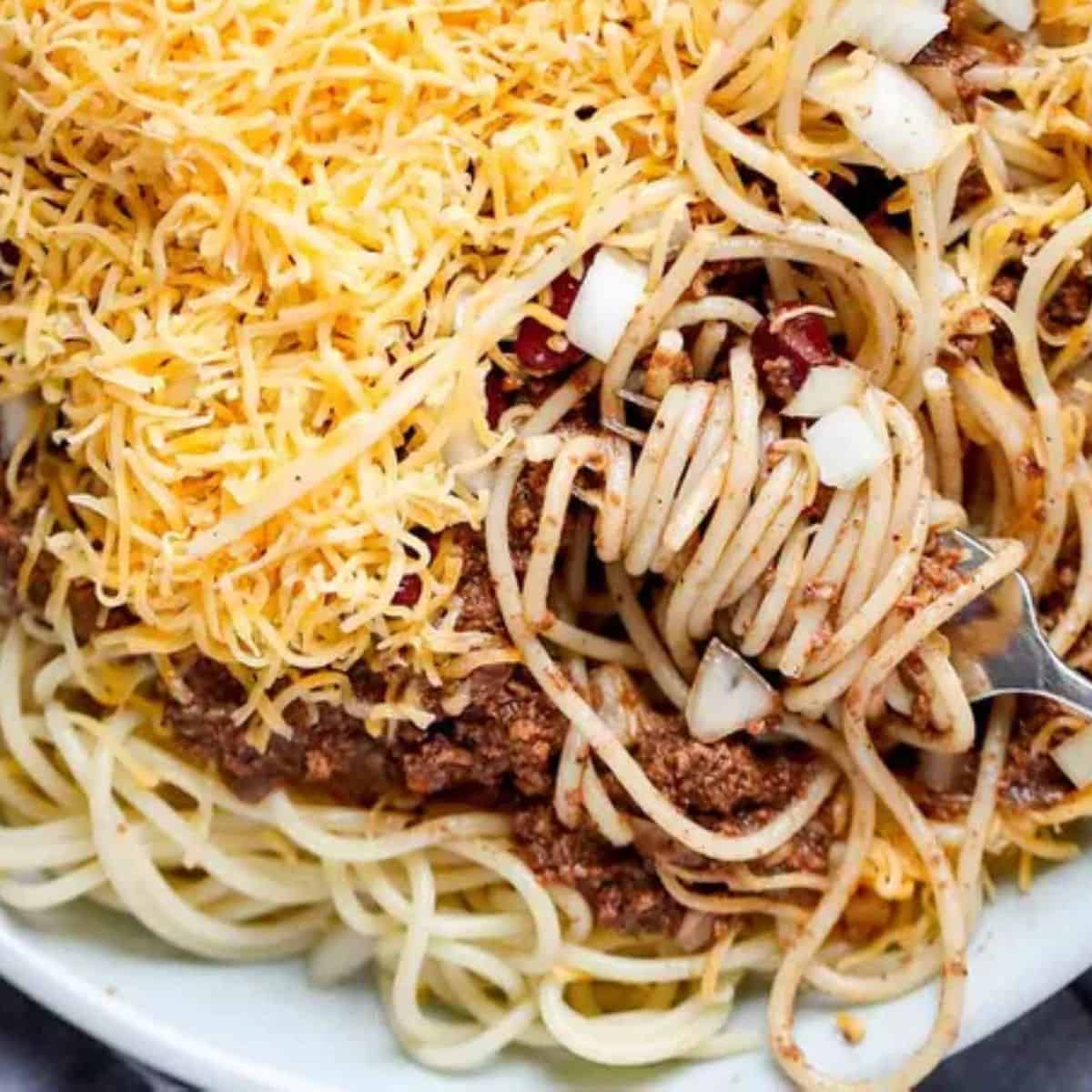 A flavorful bowl of Cincinnati Chili, made with ground beef, spices, and a unique blend of seasonings, typically served over spaghetti or hot dogs.
