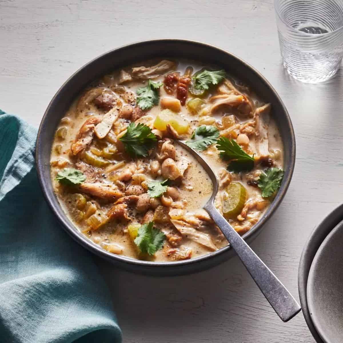 A rich and creamy bowl of White Chili, featuring tender chicken, beans, and a velvety cream cheese base for a comforting meal.
