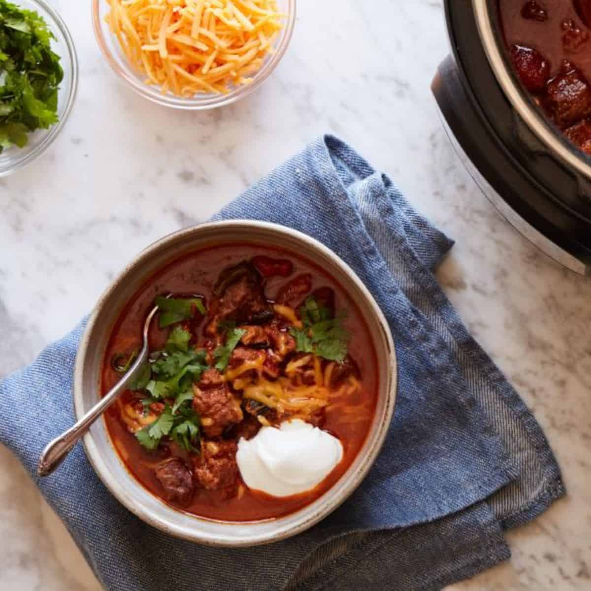 A rich and flavorful bowl of Instant Pot Keto Chili, made with ground beef, low-carb vegetables, and a blend of spices for a keto-friendly meal.
