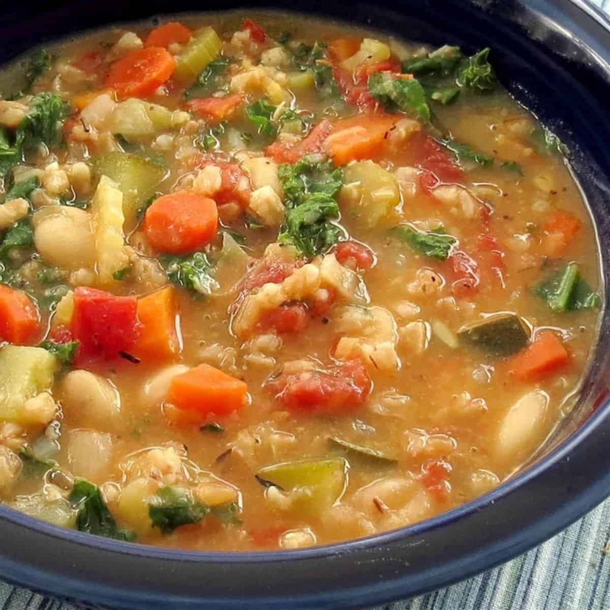 A warming delight featuring kale white bean and farro stew.