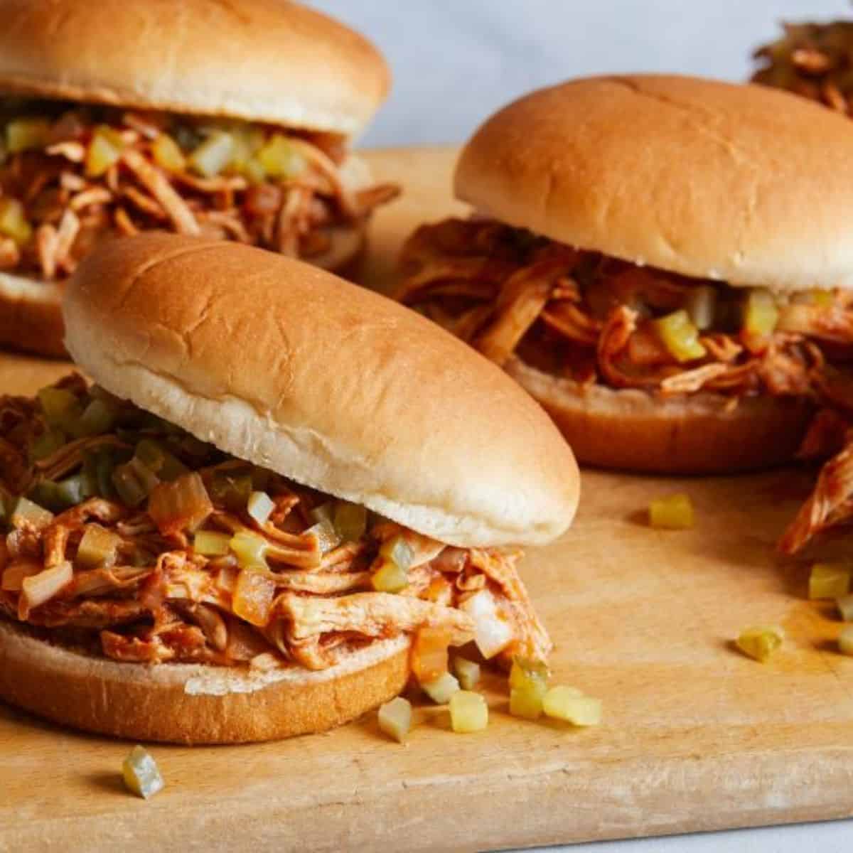 A yummy treat with shredded saucy BBQ chicken sammies.