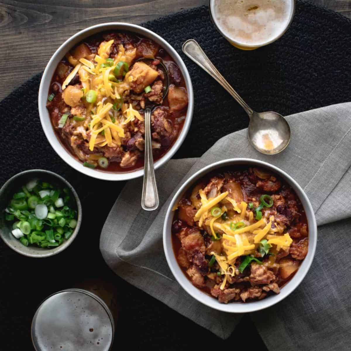 A comforting bowl of Slow-Cooker Turkey Chili with Butternut Squash, featuring lean turkey, tender squash, beans, and a mix of savory spices.
