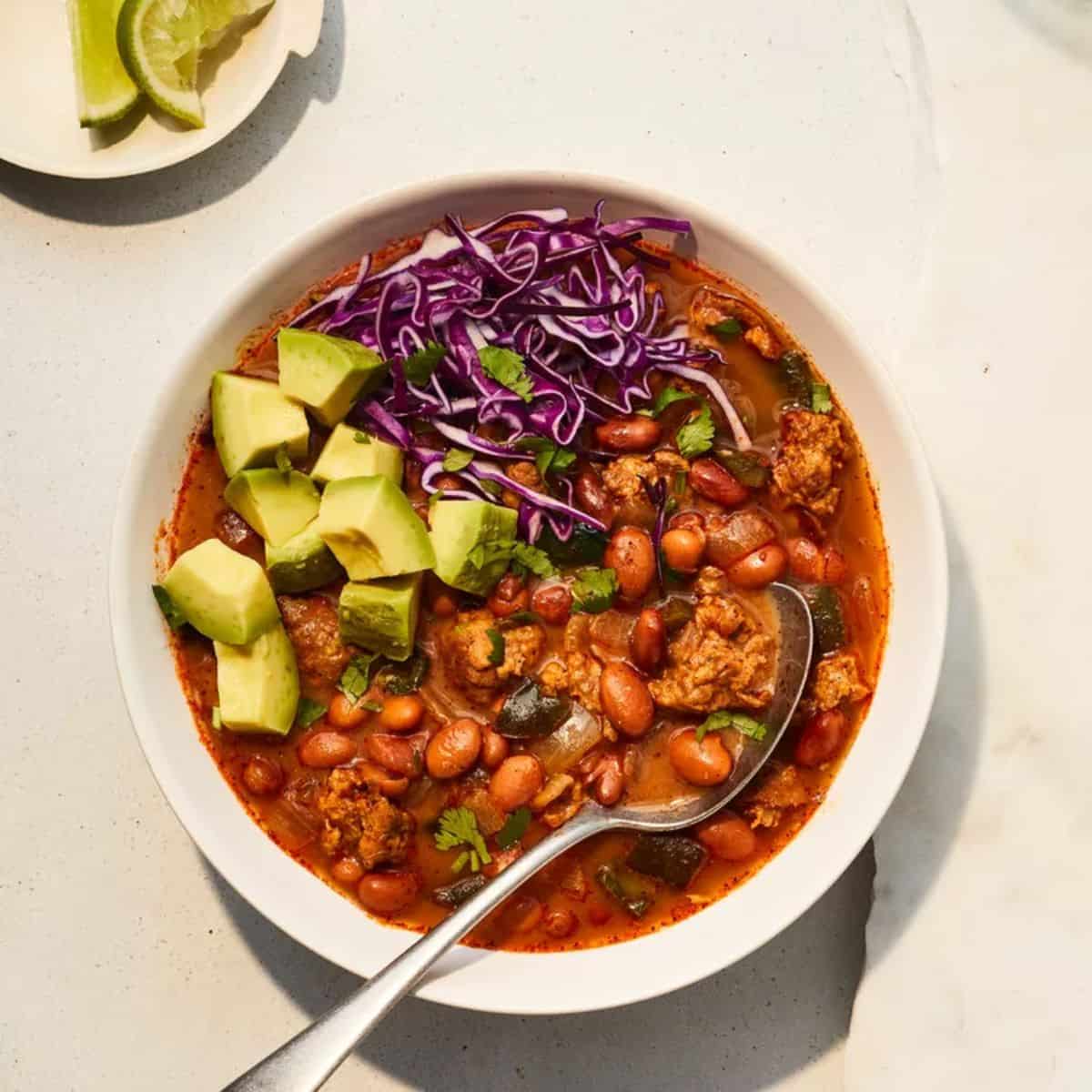 A bold and spicy bowl of Chorizo and Pinto Bean Chili, featuring flavorful chorizo sausage, pinto beans, tomatoes, and a blend of spices.
