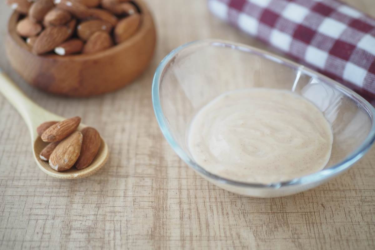 fresh almond yogurt in a bowl on table