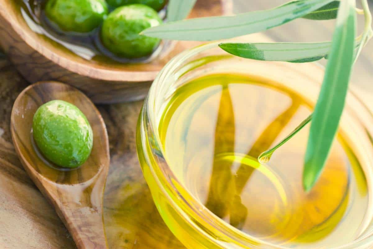 olive oil with fresh olives
