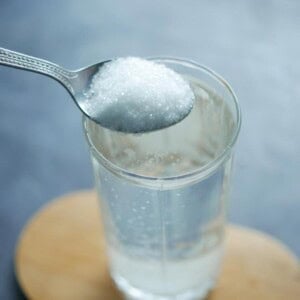 pouring white sugar water