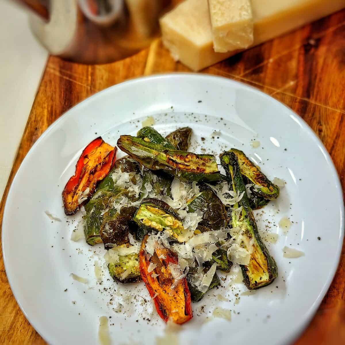 roasted jalapenos in air fryer on a white plate
