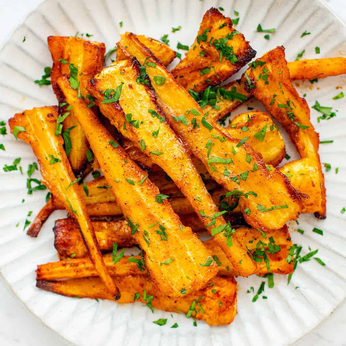 air fryer parsnips on a white plate