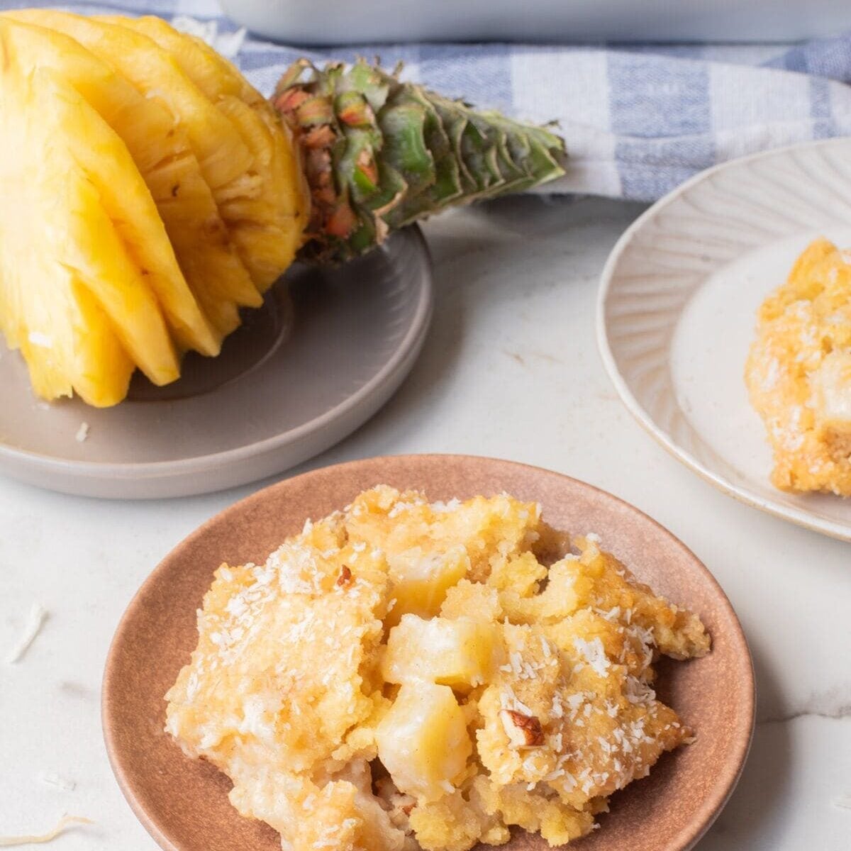 coconut pineapple dump cake and pineapple on a table