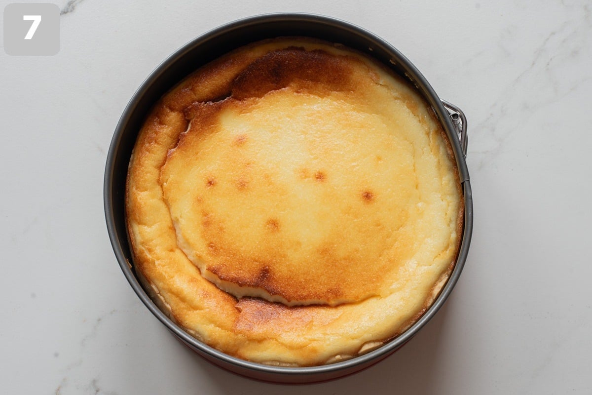 Turn off the oven and leave the cheesecake inside with the door slightly open.