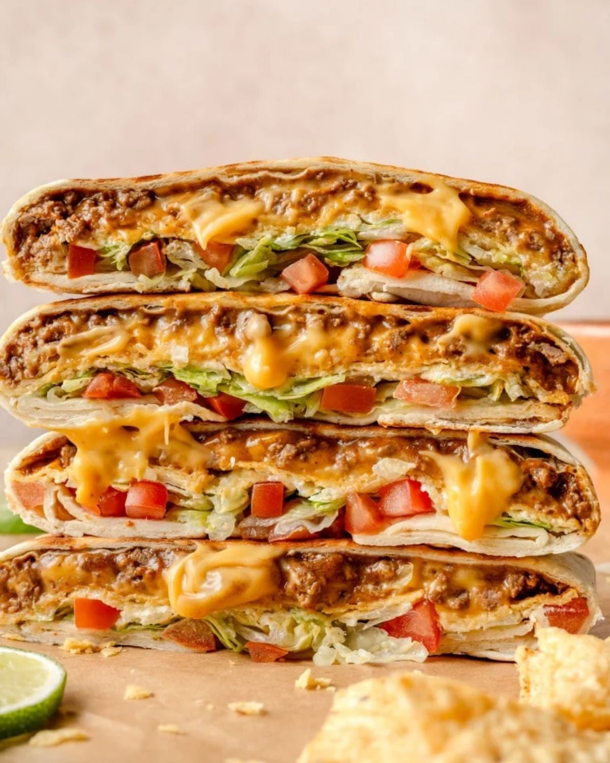Easy homemade crunchwrap supreme stuffed with ground beef, melted cheese, lettuce, and tomatoes for a quick dinner recipe