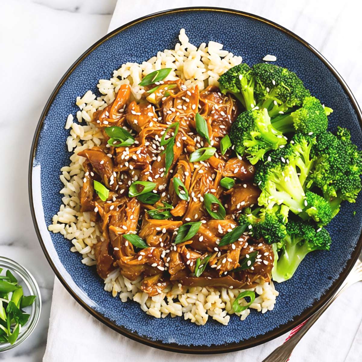 Tender honey garlic chicken served with brown rice and steamed broccoli, featuring an effortless dump and go crockpot dinners chicken recipe.