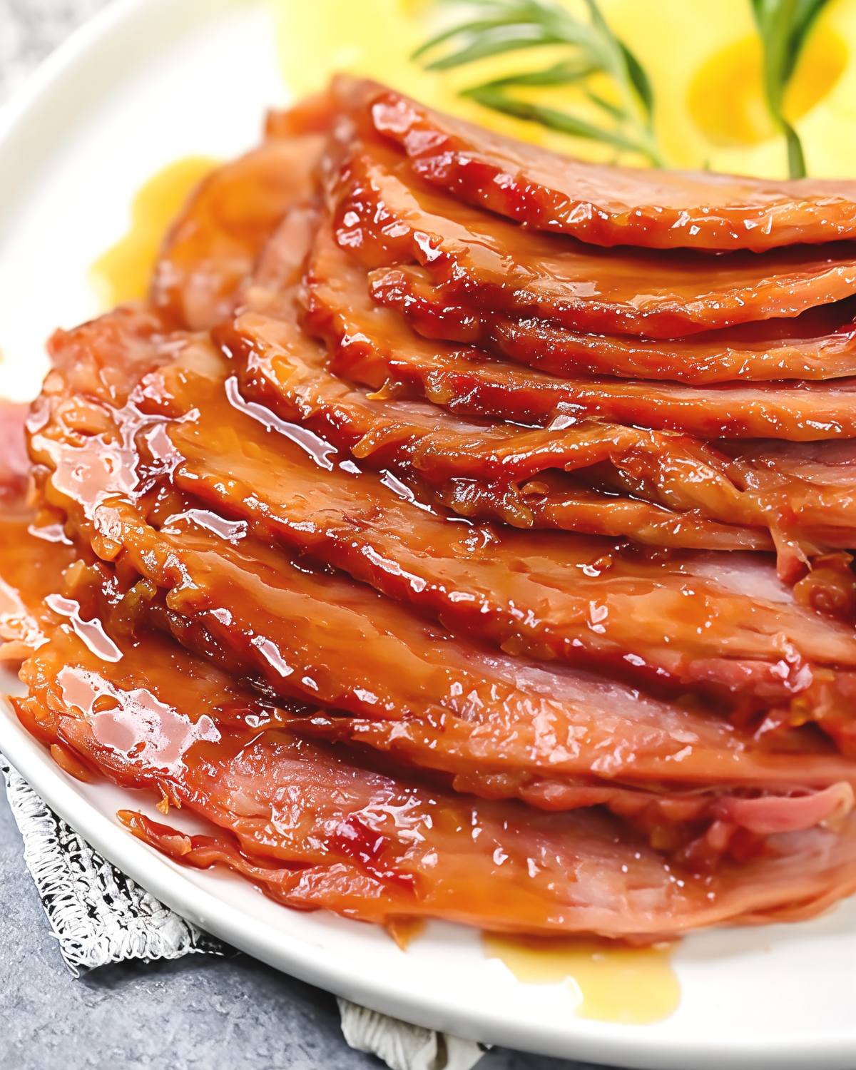 Maple Brown Sugar Ham with a delicious sauce drizzled over the top